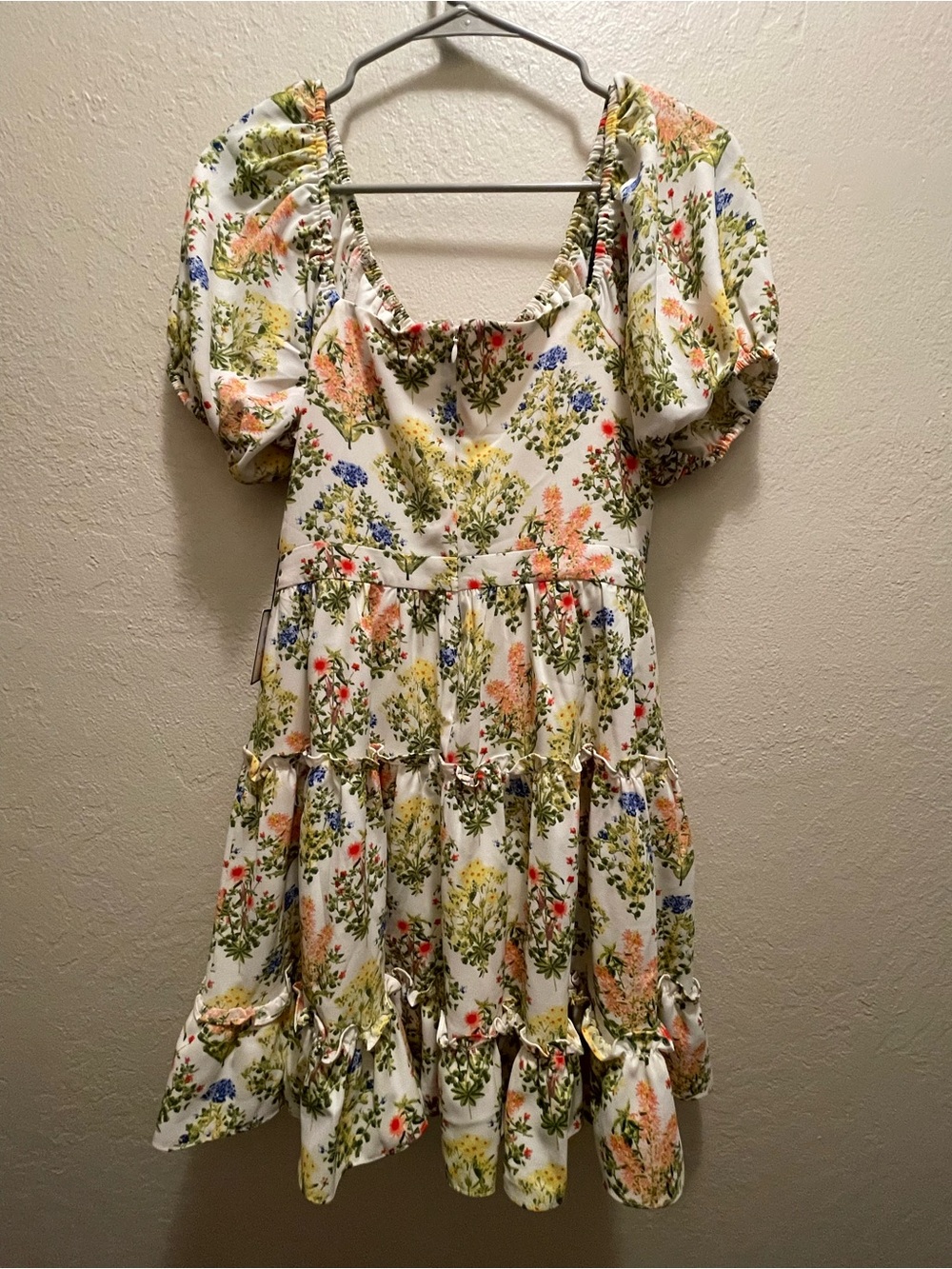 Laundry clothing tag on floral fabric